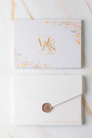 Beautiful bespoke luxury wedding invitation envelope with a hand drawn flower illustration with a custom wax seal stamp, made by Auréon.